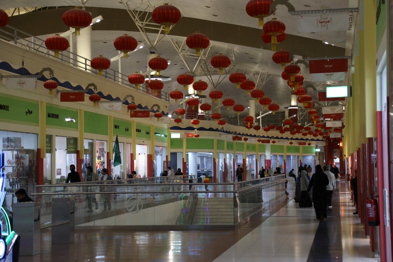 Inside the Dragon World mall, under rows of red lanterns
